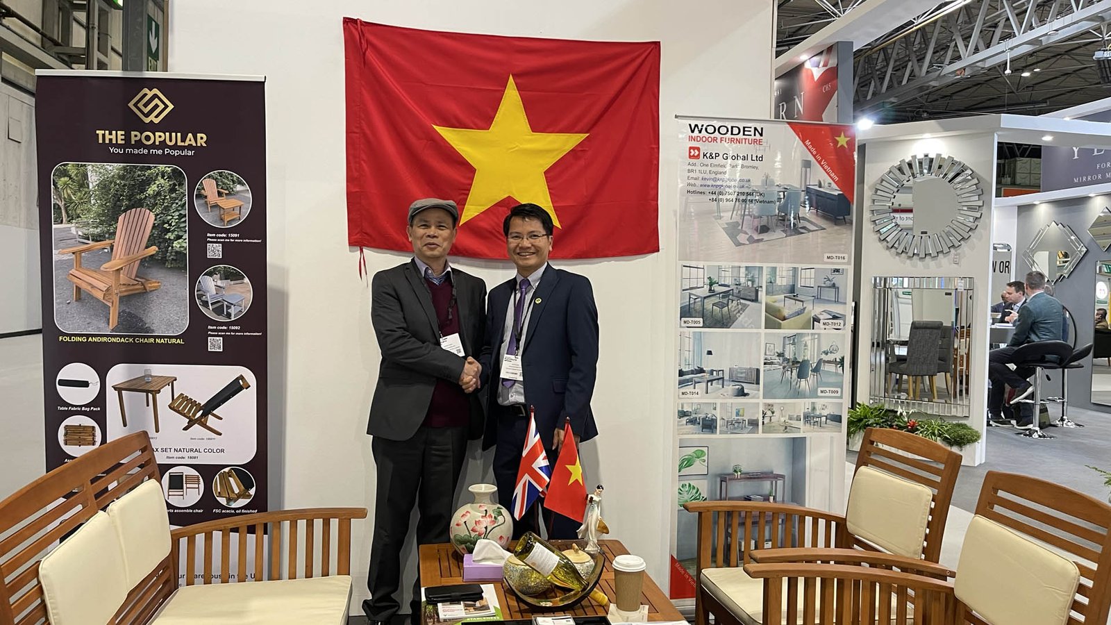 Mr. Kevin Pham, on the right, with a Vietnamese government trade representative at a furniture trade show in the UK.