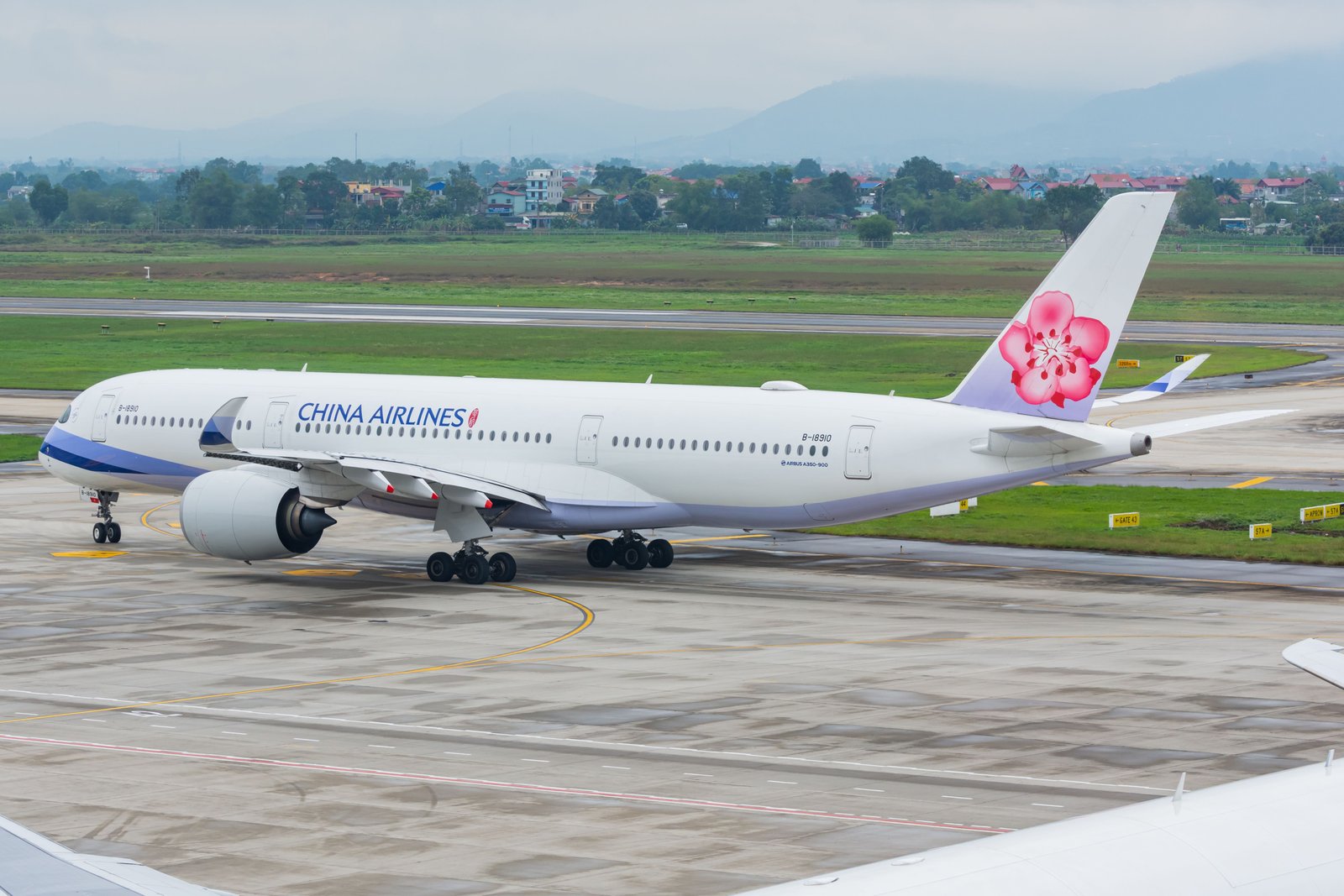 Ha Noi, Vietnam - March 17, 2019: China Airlines Airbus A350-900 is taxiing to runway at Hanoi Noi Bai International Airport (HAN) for its departure back to Taipei, Taiwan (TPE).