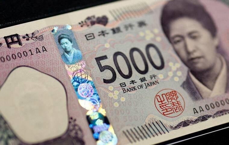 REUTERS/ISSEI KATO/POOL/ FILE PHOTO
                                Holograms, which show different images and colors depending on the angle at which they are viewed, are seen on the new 5,000-yen banknote as the new note is displayed at a currency museum of the Bank of Japan, on the day the new notes of 10,000 yen, 5,000 yen and 1,000 yen went into circulation, in Tokyo, on July 3. The yen rose to a three-week high against the dollar today, while the greenback rallied from an eight-month low, as geopolitical tension in the Middle East intensified, prompting investors to seek shelter in these currencies.